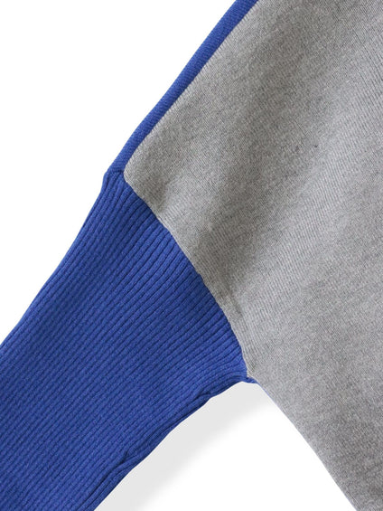 【WEB限定】”前後で印象が変わる”ドルマンバイカラーニット